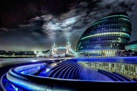 London City Hall with the London Tower Bridge just after midnight. Only a few people hovers around the area. The stars are peaking out from the skies. Photo by: Jacob Surland, www.caughtinpixels.com
